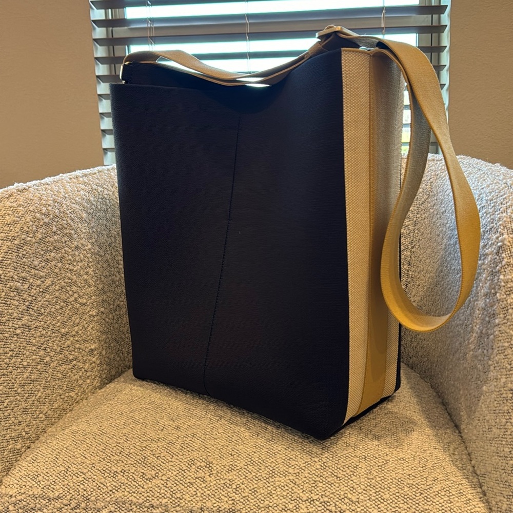 Rothy’s lightweight crossbody bag/tote. Navy, tan, and dark khaki.